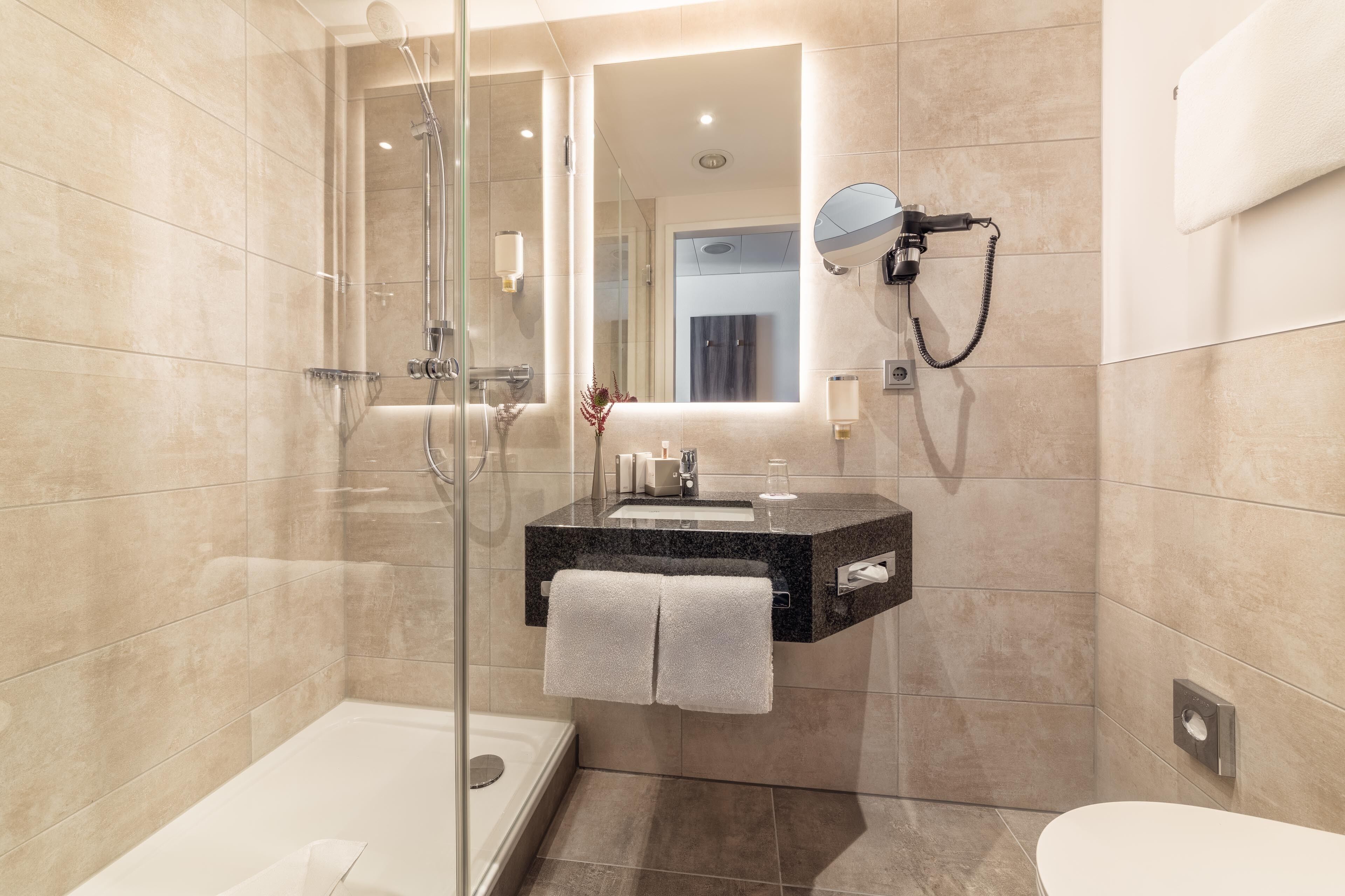 superior single room (cathedral view) | bathroom | shower, free toiletries, hair dryer, towels