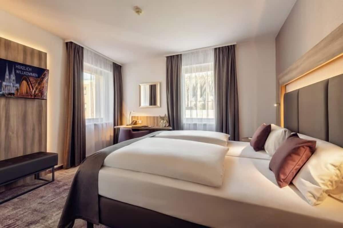 Hypoallergeen beddengoed, een minibar, een kluis op de kamer, een bureau