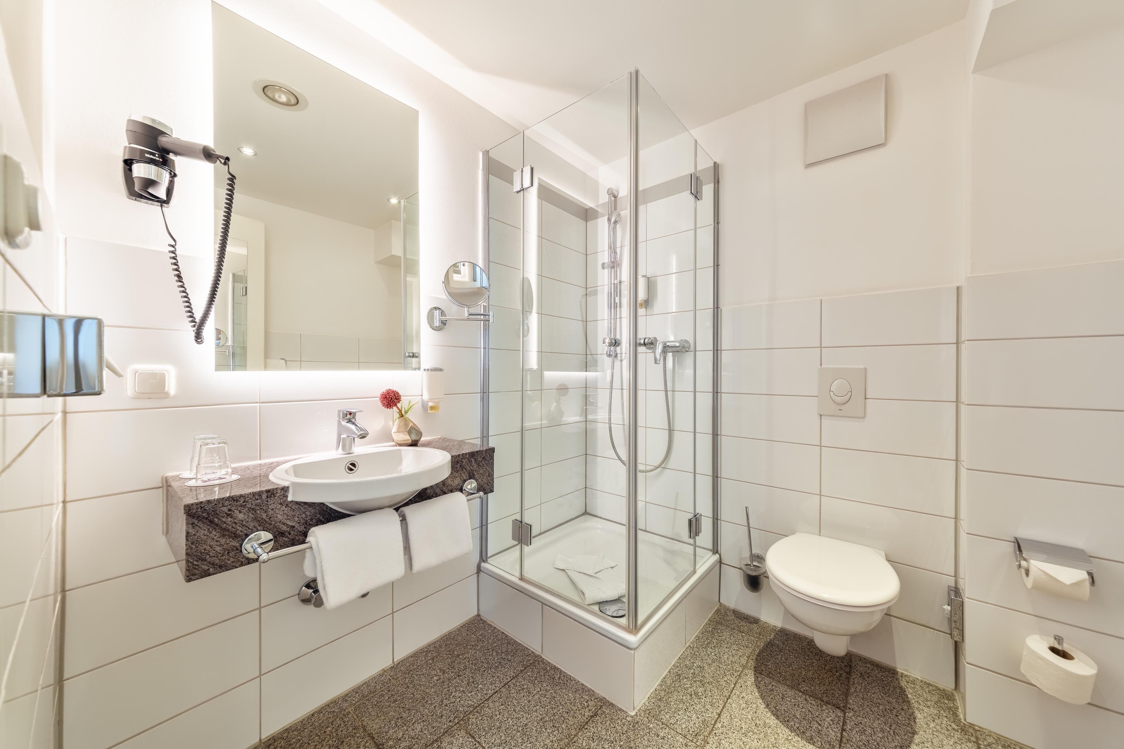 shower, free toiletries, hair dryer, towels