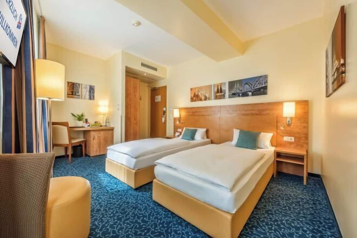 Hypoallergeen beddengoed, een minibar, een kluis op de kamer, een bureau