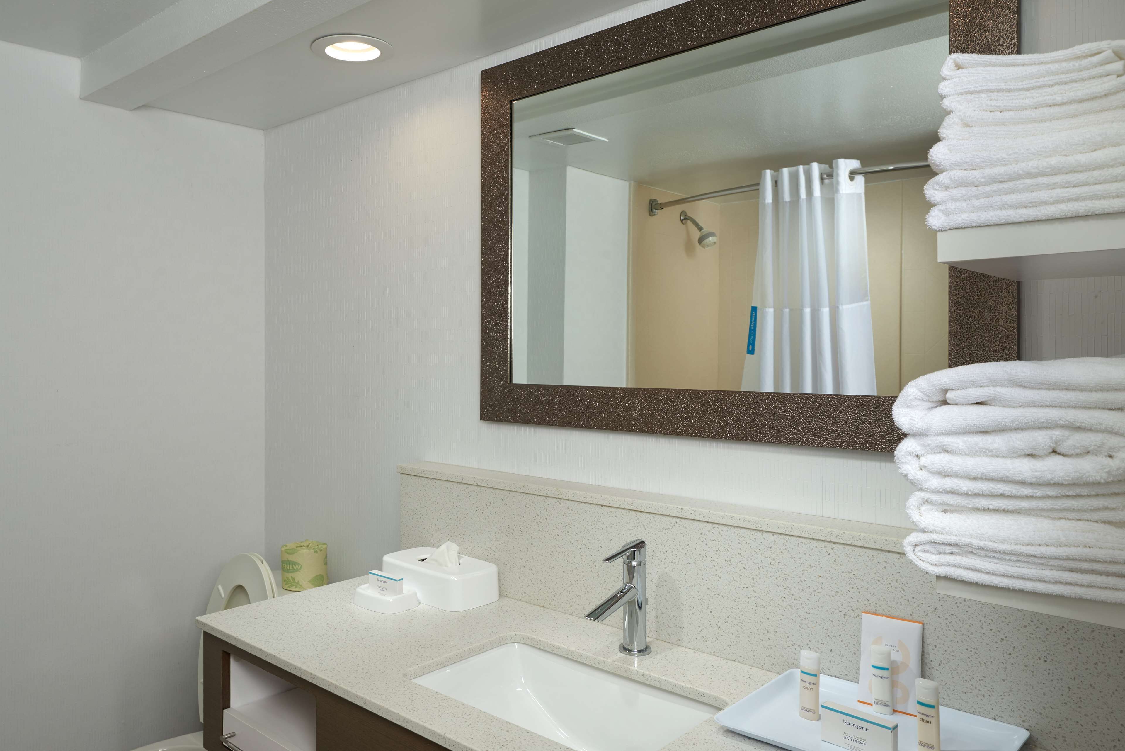 bathtub, free toiletries, hair dryer, towels