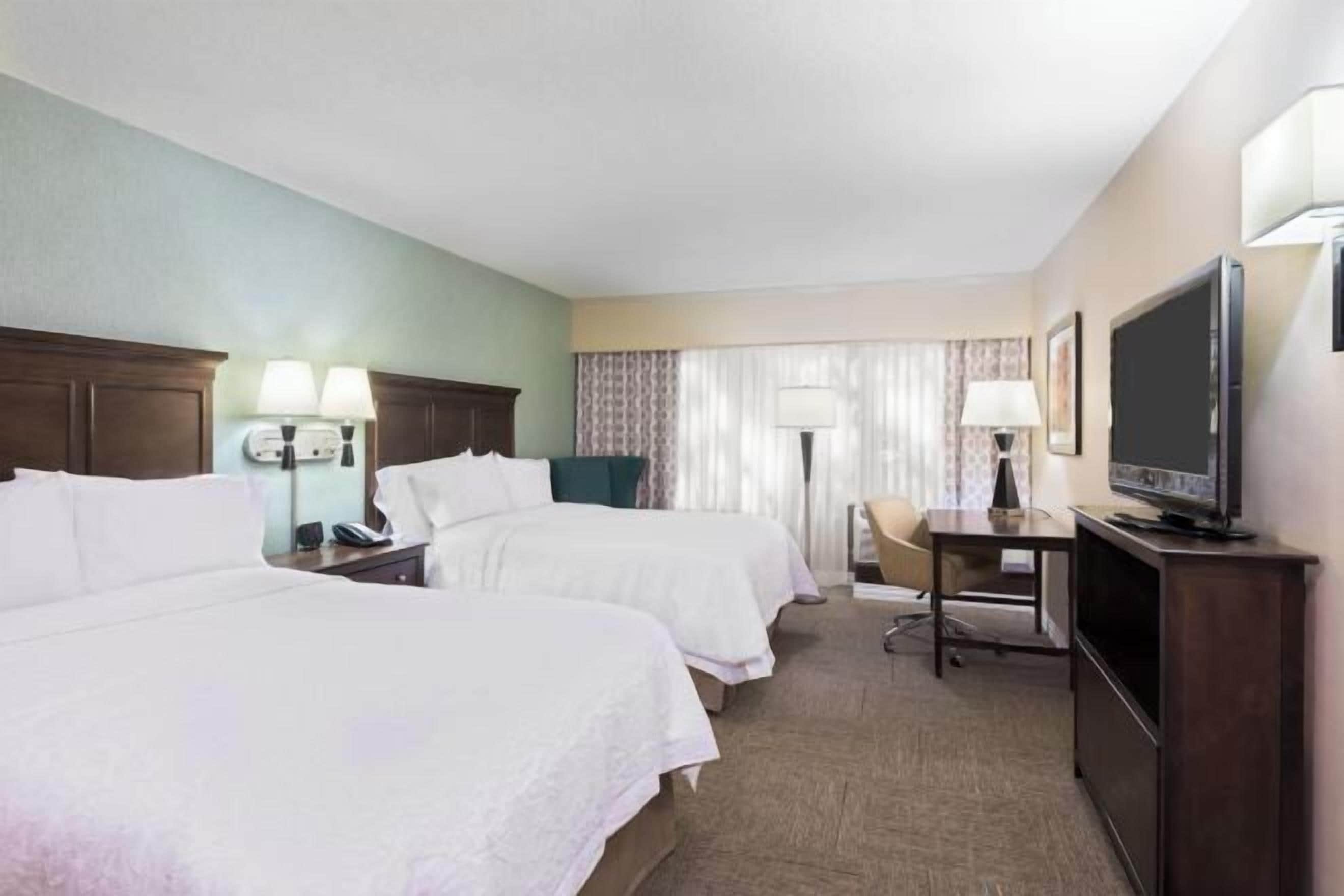 Desk, laptop workspace, blackout drapes, iron/ironing board