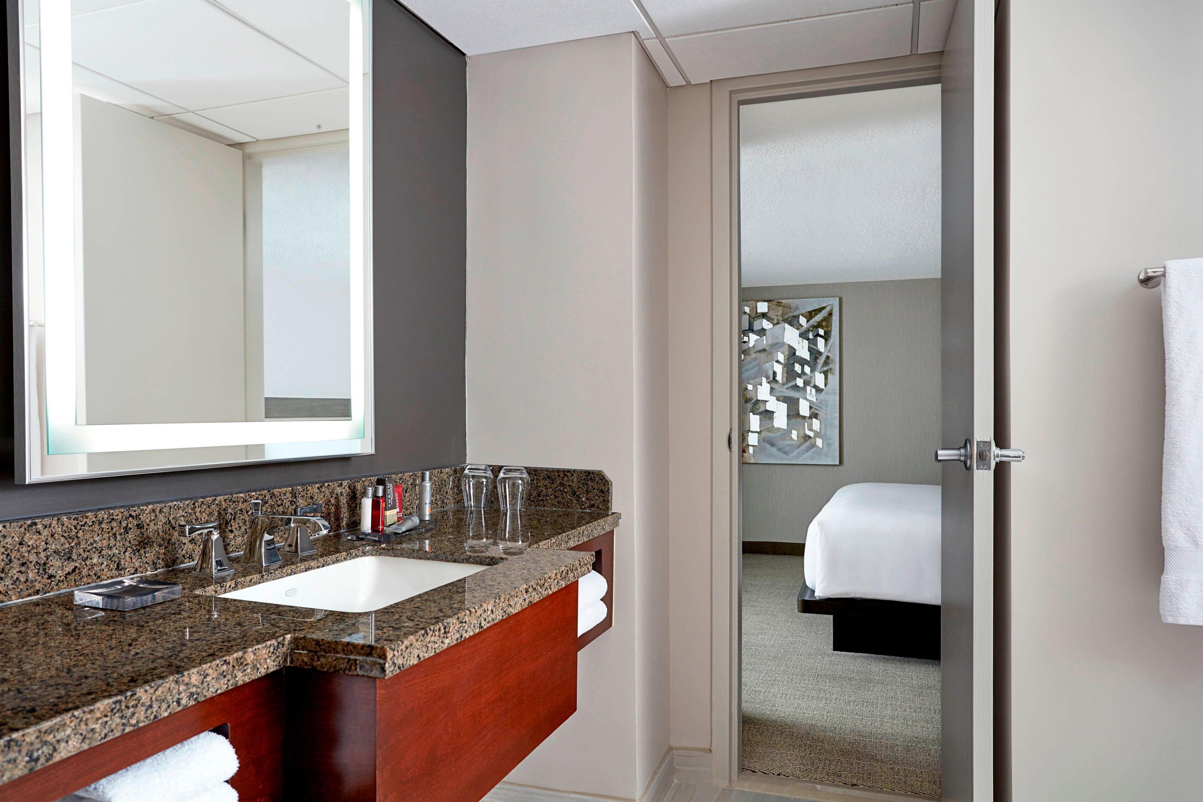 combined shower/bathtub, designer toiletries, hair dryer, bathrobes