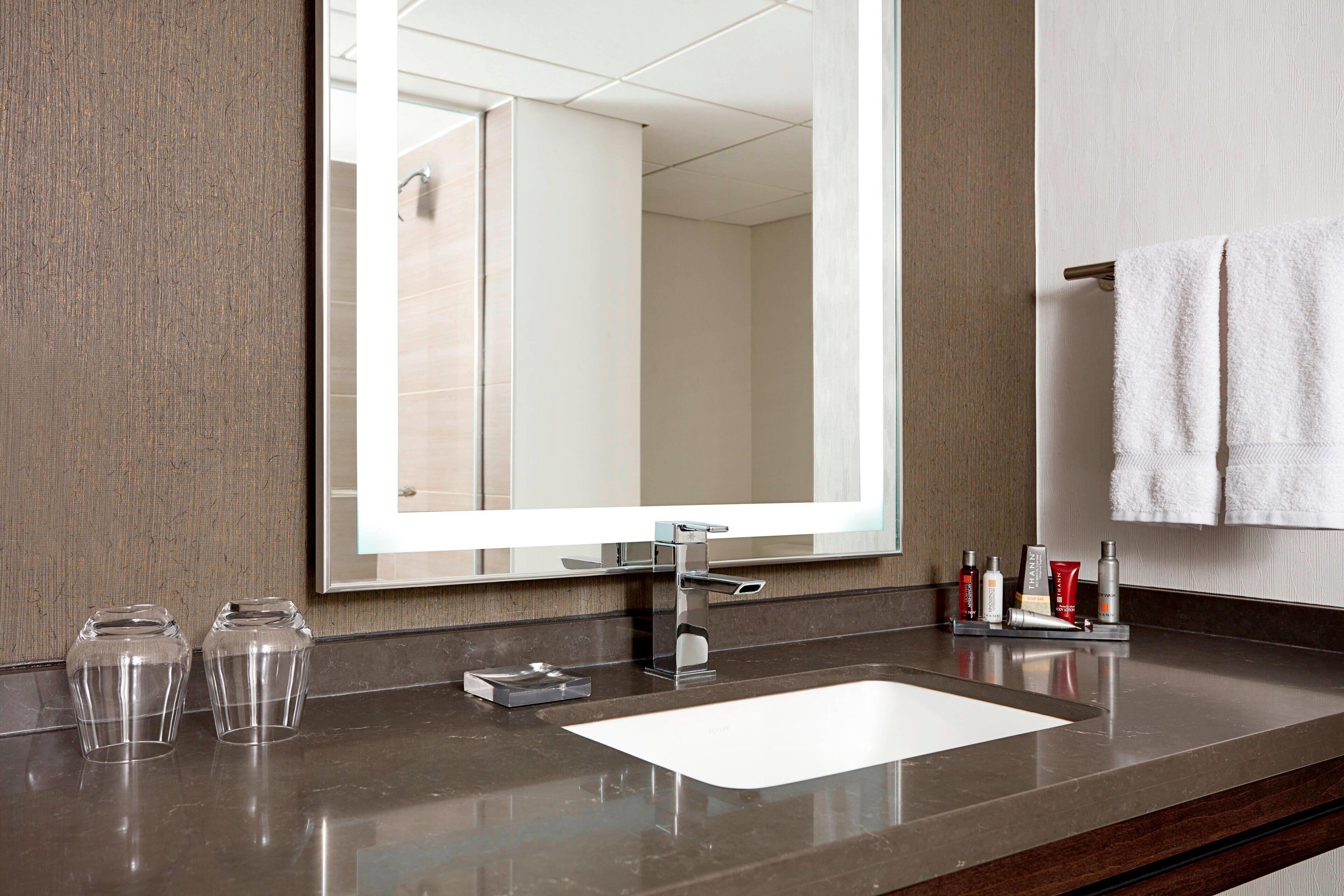 combined shower/bathtub, designer toiletries, hair dryer, bathrobes