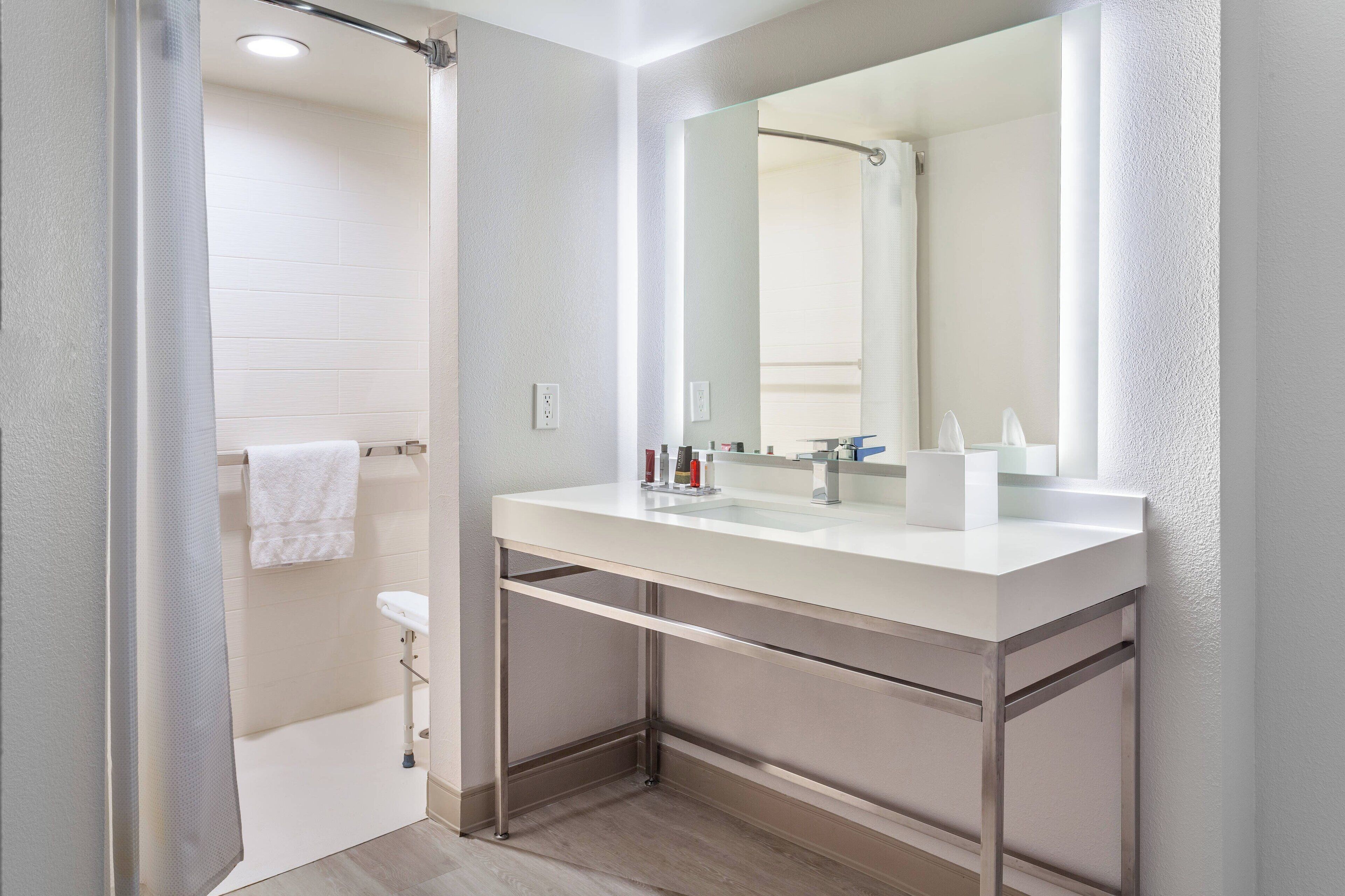 deep-soaking bathtub, designer toiletries, hair dryer, towels