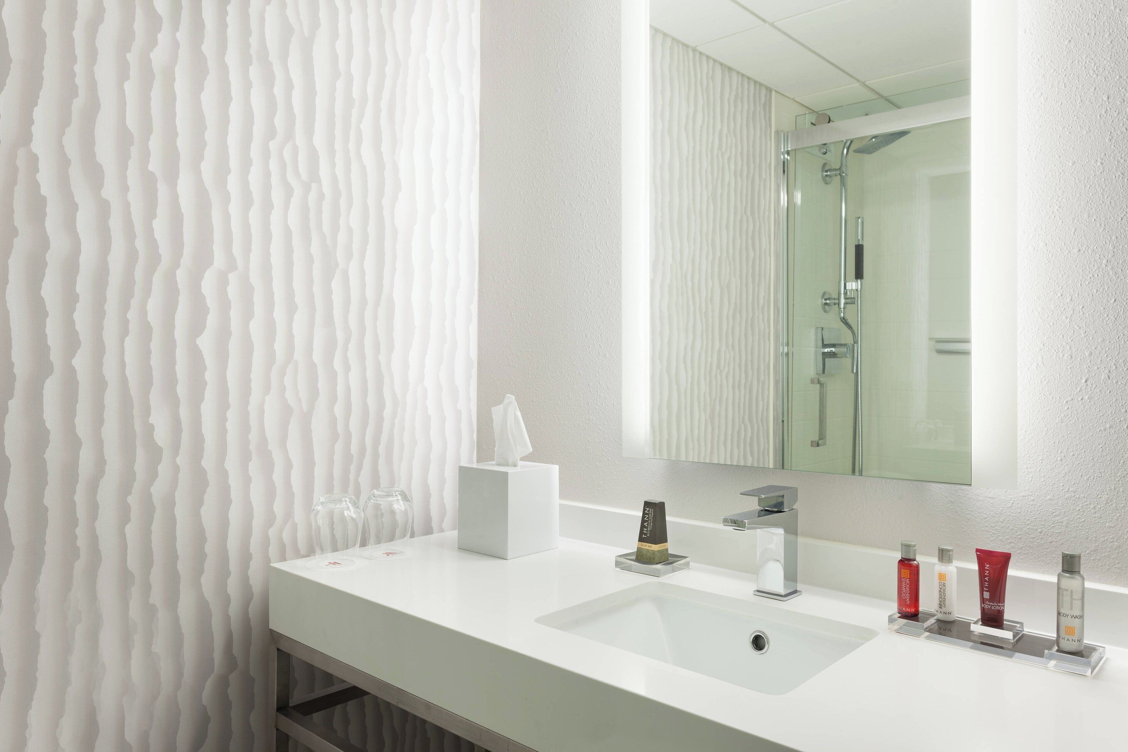 deep-soaking bathtub, designer toiletries, hair dryer, towels