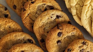 A tray of freshly baked cookies, some with chocolate chips. - Garner Hotel Totowa by IHG (Totowa)