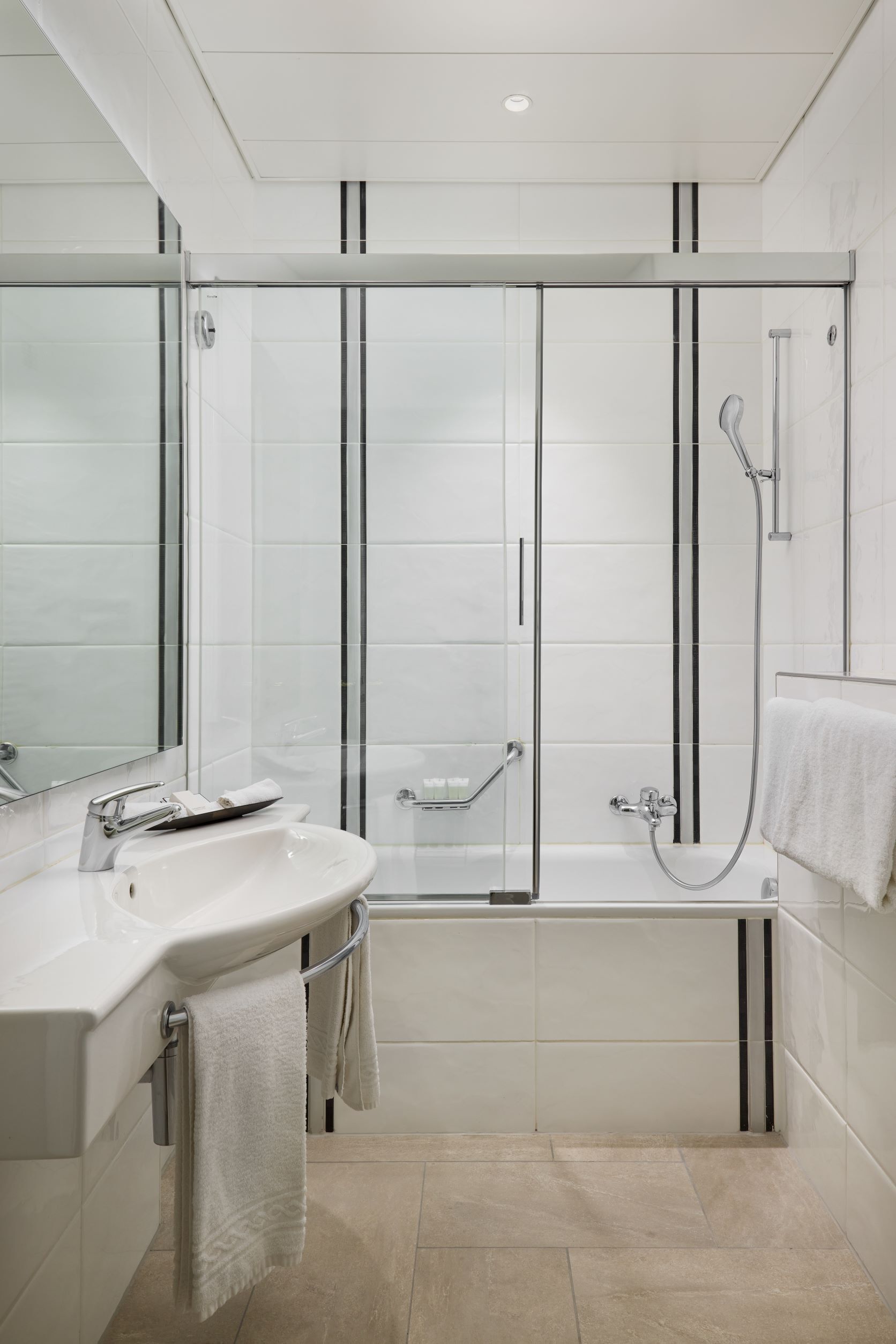 junior suite | bathroom | combined shower/bathtub, hair dryer, slippers, towels