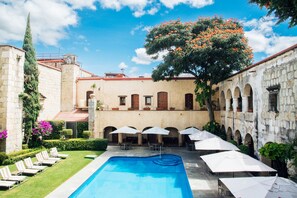 Outdoor pool, pool umbrellas, sun loungers