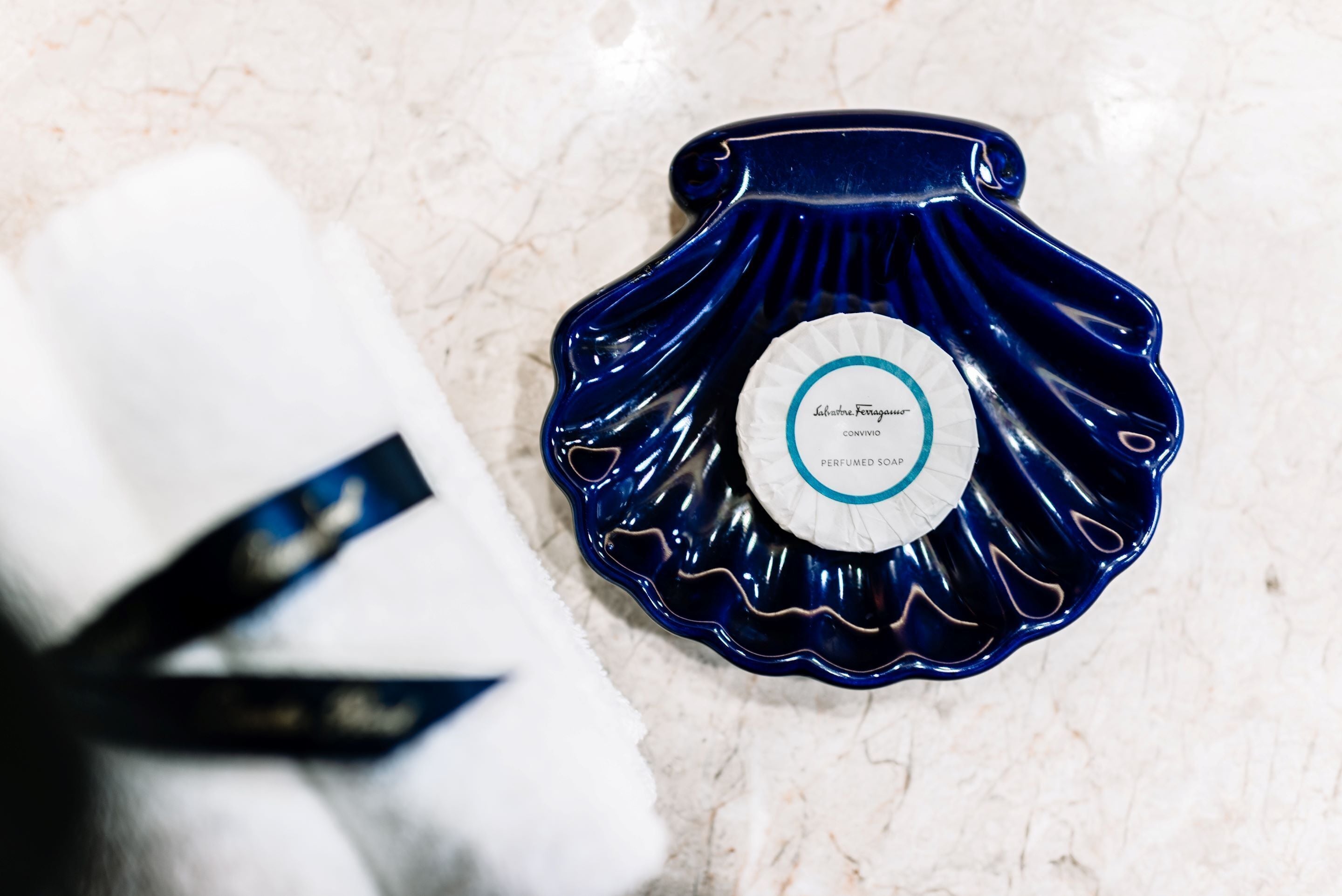 designer toiletries, hair dryer, bathrobes, slippers