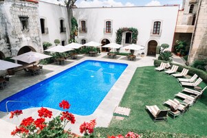 Outdoor pool, pool umbrellas, pool loungers