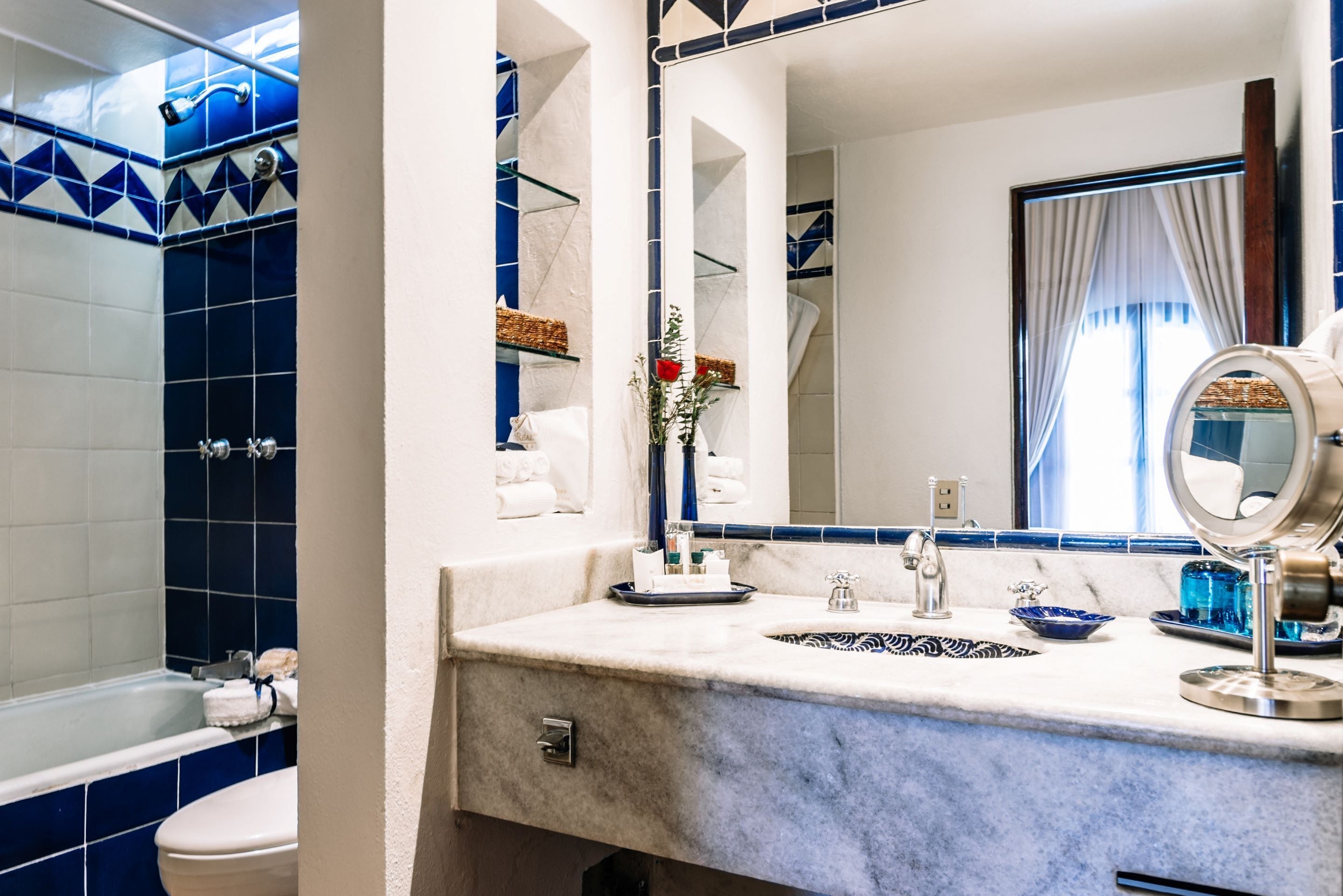 designer toiletries, hair dryer, bathrobes, slippers