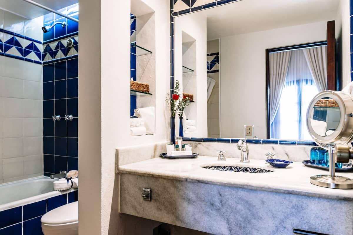 designer toiletries, hair dryer, bathrobes, slippers