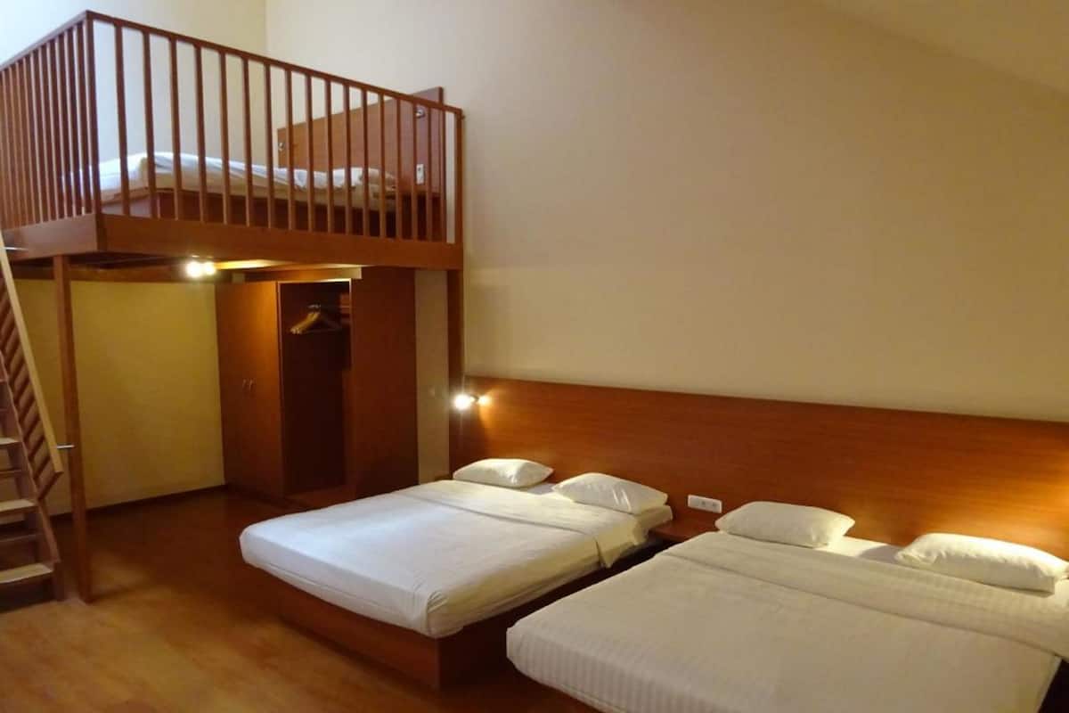 Hypo-allergenic bedding, free minibar items, in-room safe, desk