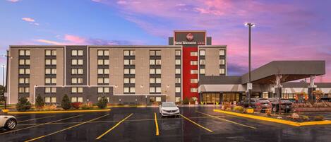 A Best Western hotel with a parking lot and a modern building facade.
