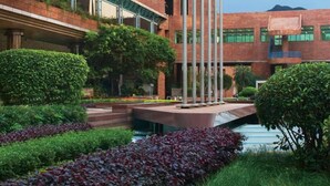 A large brick building with multiple floors and a curved facade, featuring a prominent sign for the Royal Park Hotel. - Royal Park Hotel (Sha Tin)