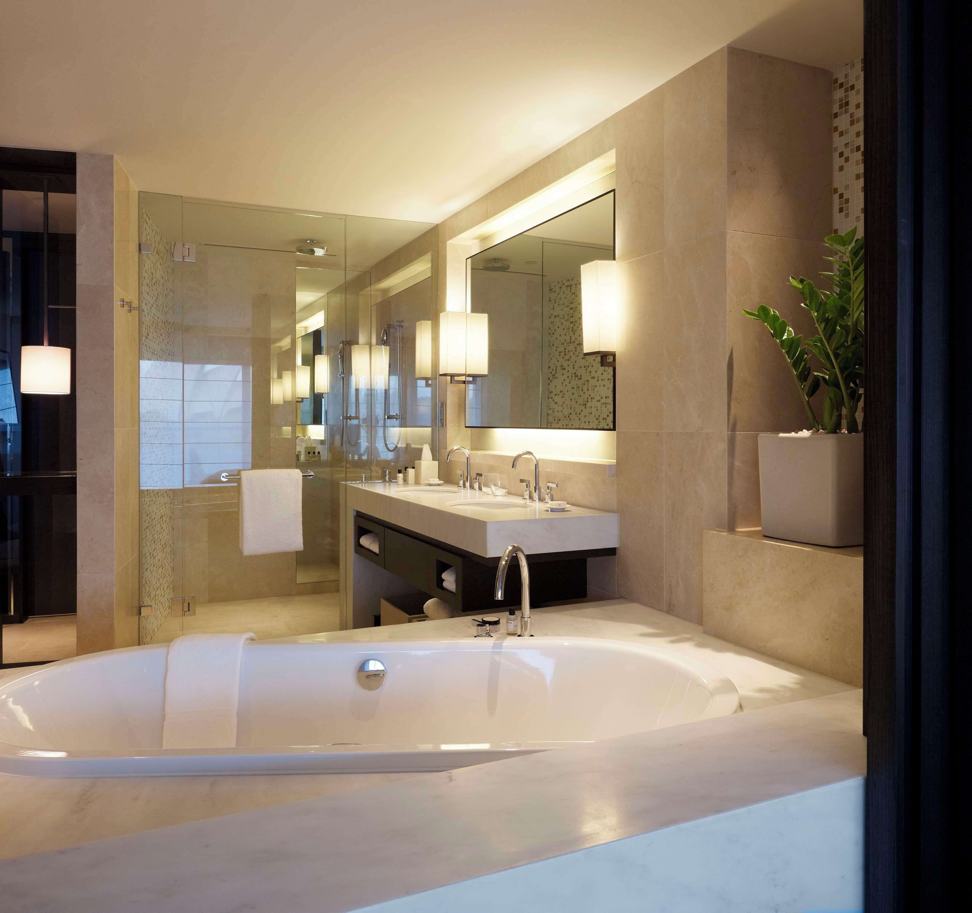 separate bathtub and shower, deep-soaking bathtub, designer toiletries