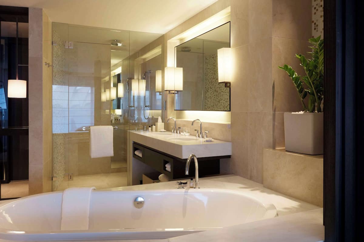 separate bathtub and shower, deep-soaking bathtub, designer toiletries