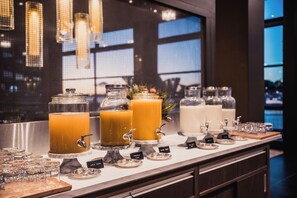 Enjoy a variety of drinks at our self-serve beverage station, featuring multiple dispensers and condiment containers.
