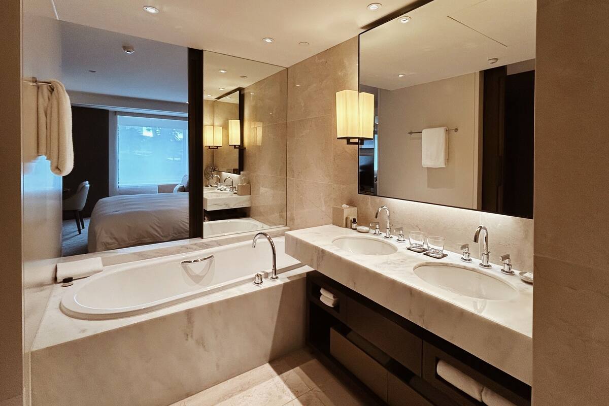 1 king bed | bathroom | separate bathtub and shower, deep-soaking bathtub, designer toiletries
