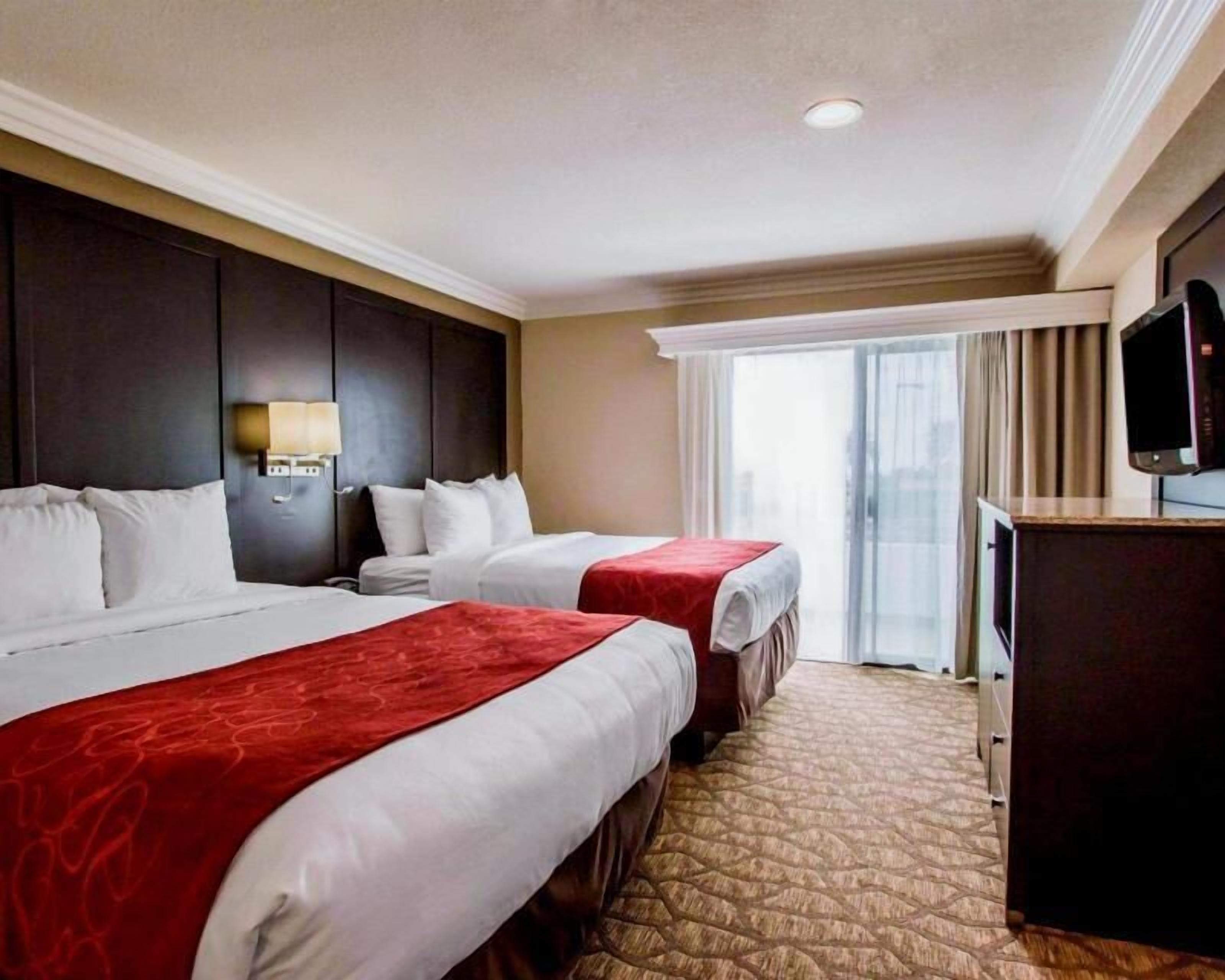Pillowtop beds, desk, blackout drapes, iron/ironing board