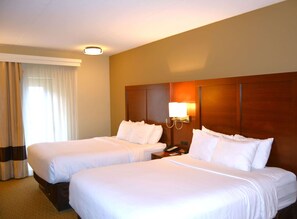 Premium bedding, pillowtop beds, desk, blackout drapes