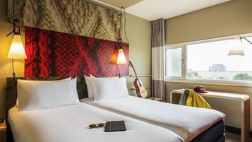 Premium bedding, desk, laptop workspace, blackout drapes