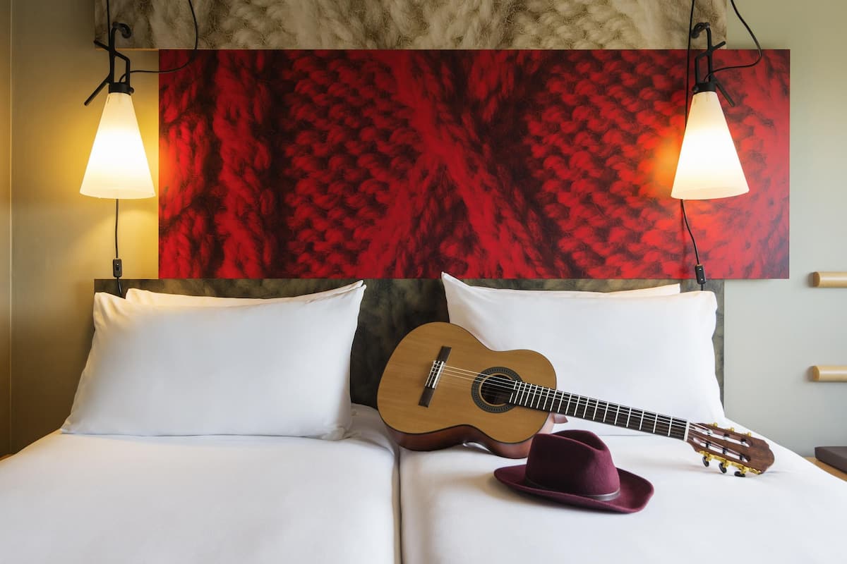 Premium bedding, desk, laptop workspace, blackout drapes