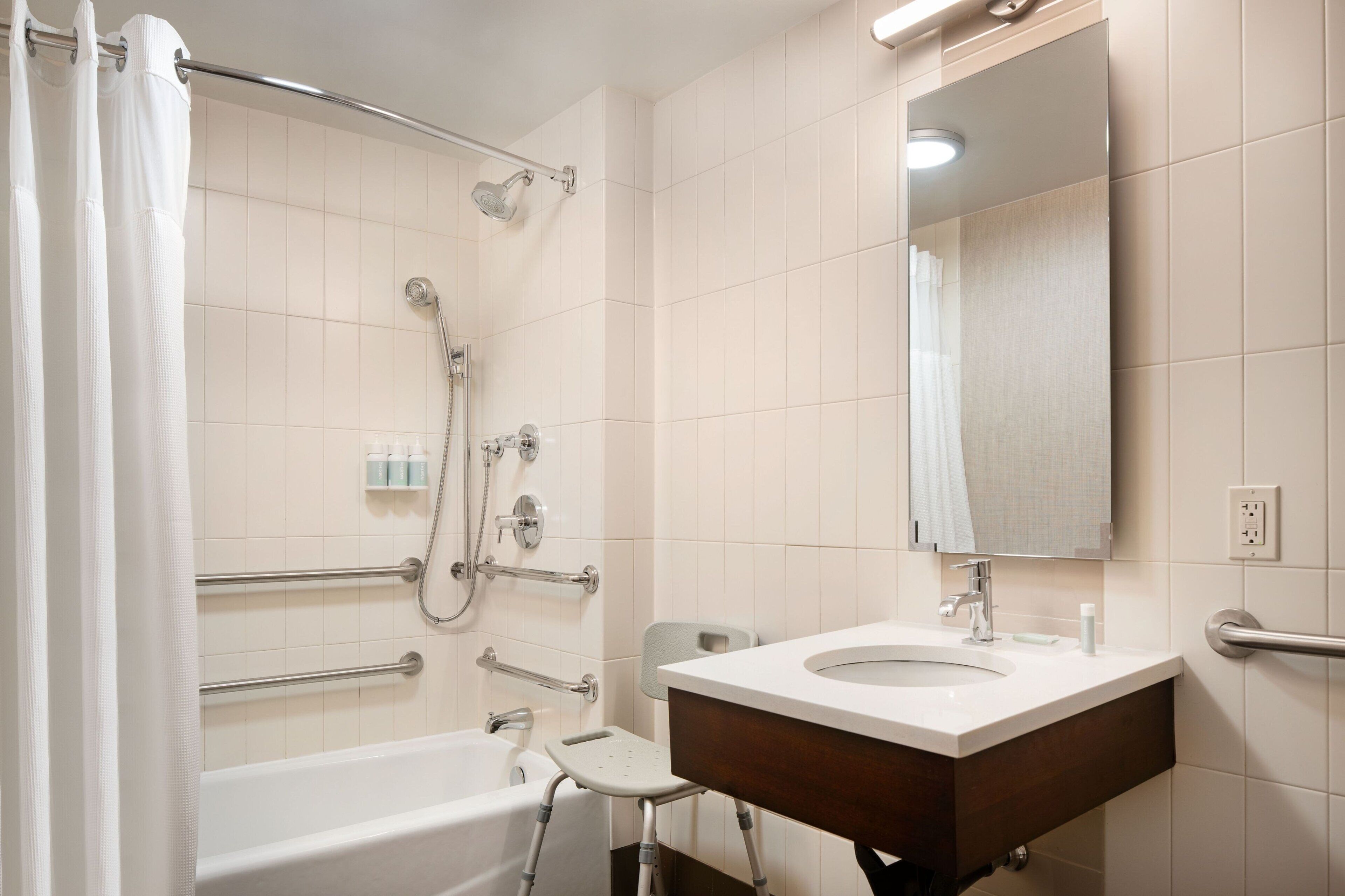 designer toiletries, hair dryer, towels