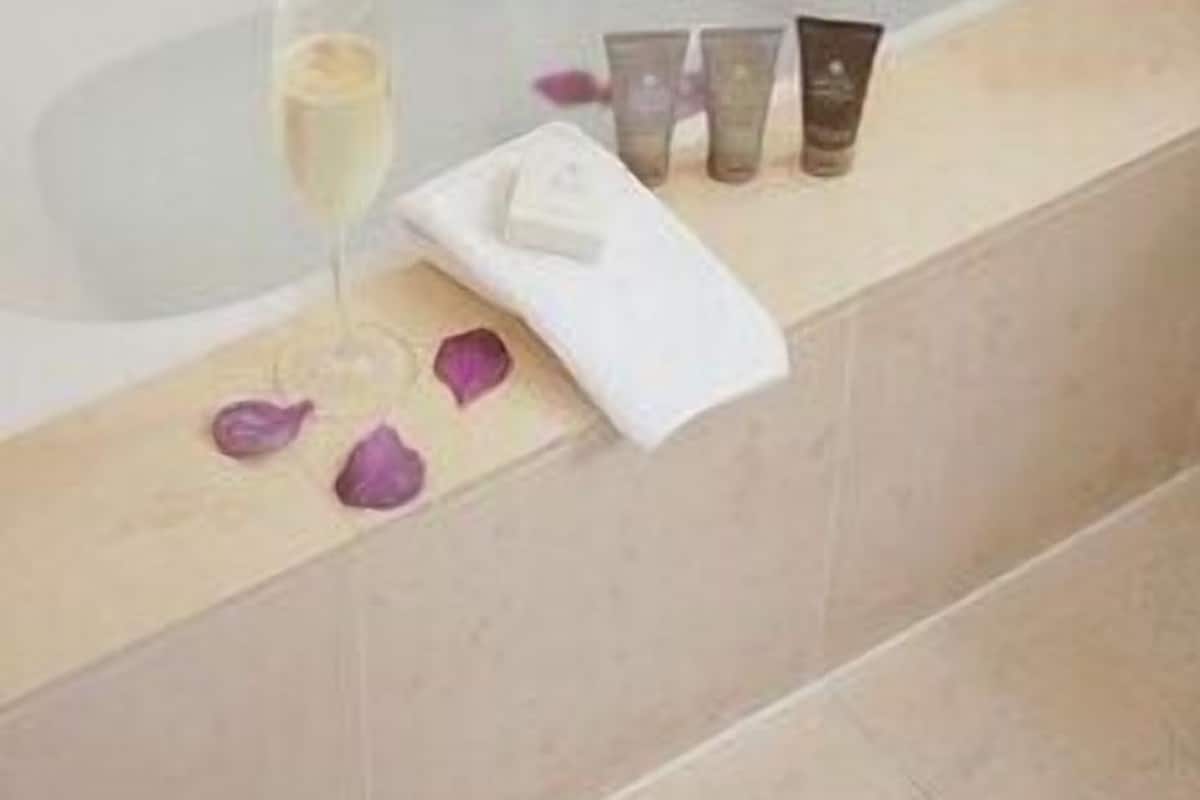 Bathroom | Designer toiletries, hair dryer, bathrobes, slippers