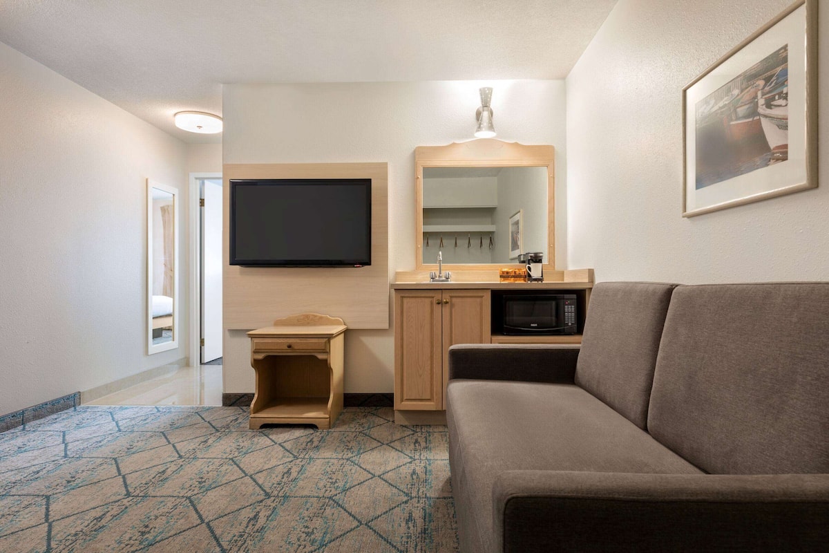 suite, 1 king bed, non smoking | desk, laptop workspace, iron/ironing board, free wifi