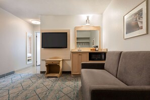 Suite, 1 King Bed, Non Smoking | Desk, laptop workspace, iron/ironing board, free WiFi
