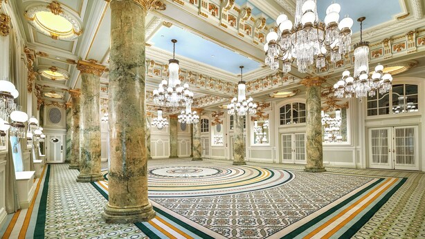 A grand hall with ornate chandeliers, marble columns, and a patterned floor. - Willard InterContinental Washington by IHG (Washington)