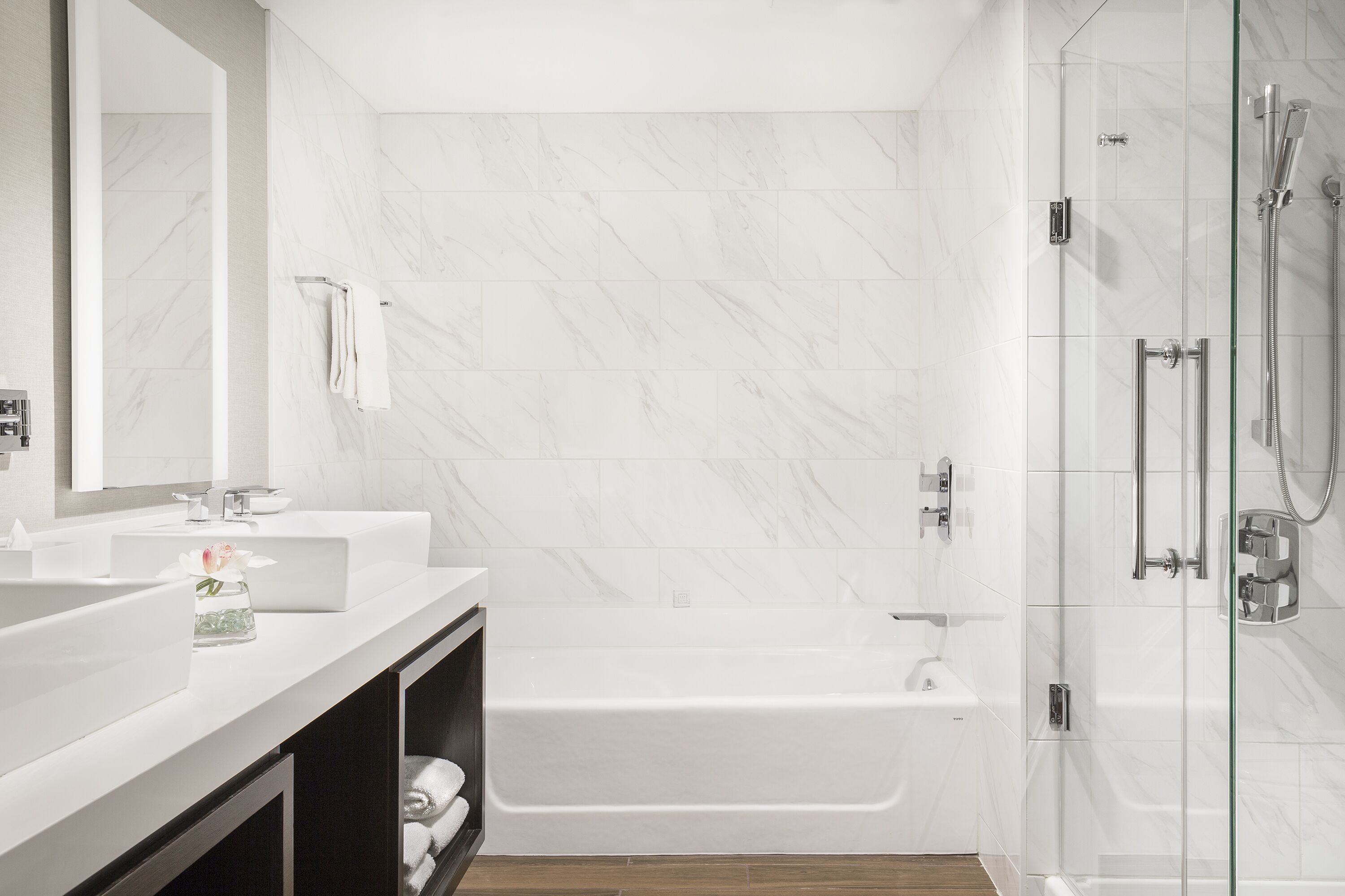 Designer toiletries, hair dryer, slippers, towels