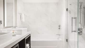 Designer toiletries, hair dryer, slippers, towels