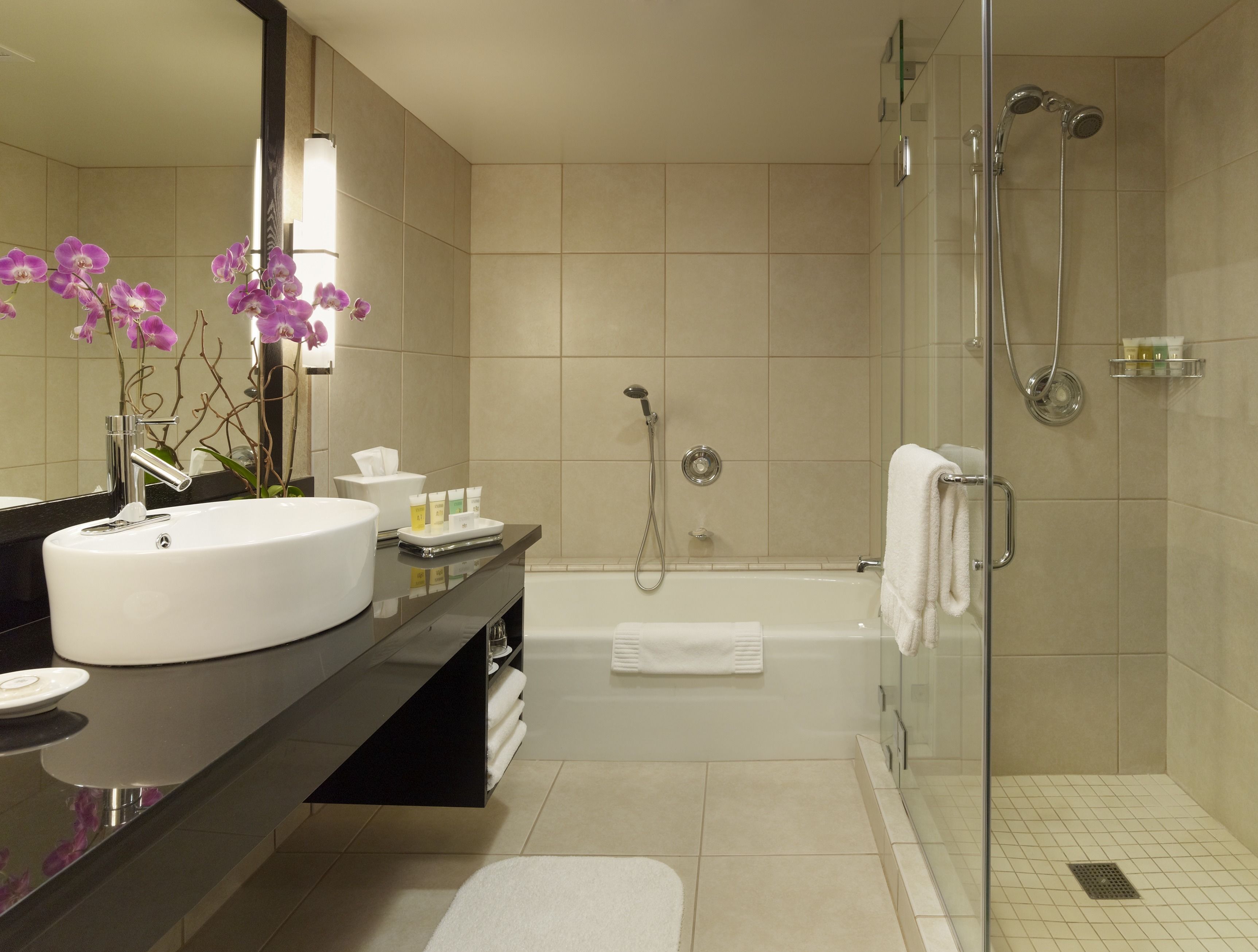 designer toiletries, hair dryer, slippers, towels