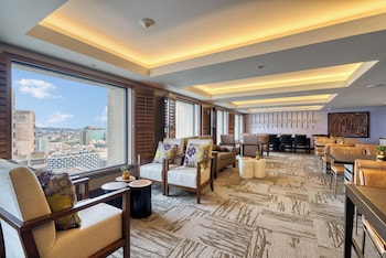 A multi-story hotel with a classic facade, large windows, and a prominent entrance. at Hotel Nikko San Francisco