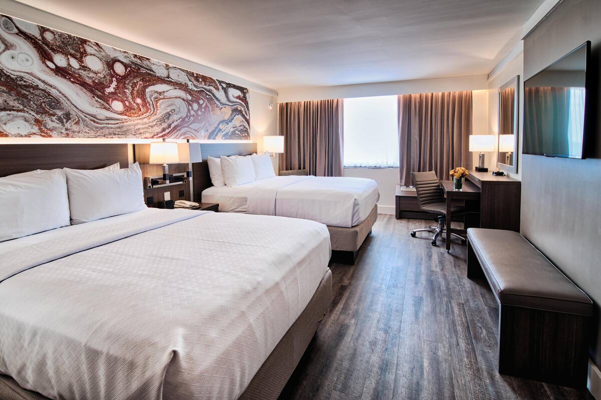 Premium bedding, desk, laptop workspace, soundproofing