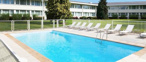 Outdoor pool, open 10:00 AM to 9:00 PM, pool loungers