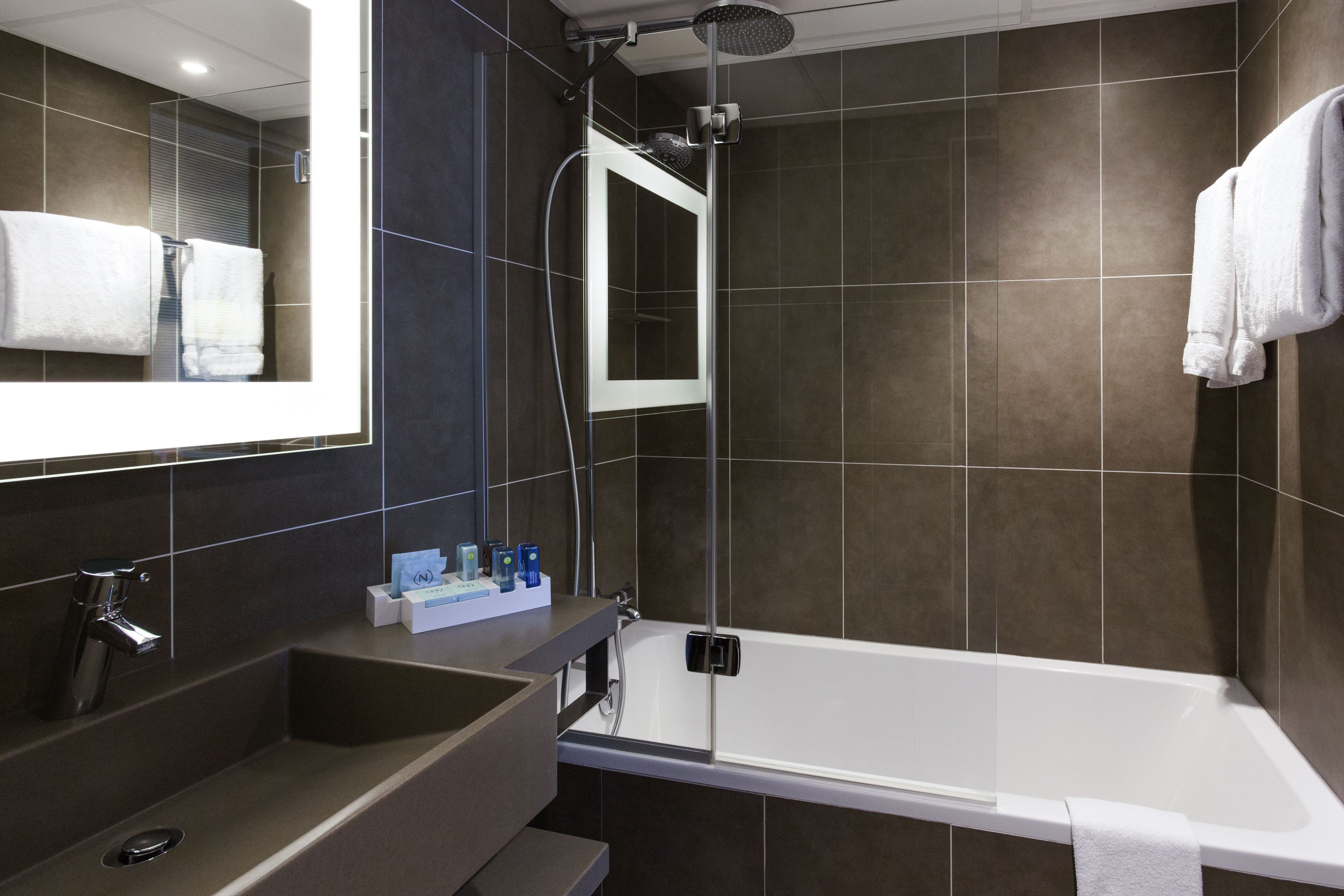 eco-friendly toiletries, hair dryer, towels