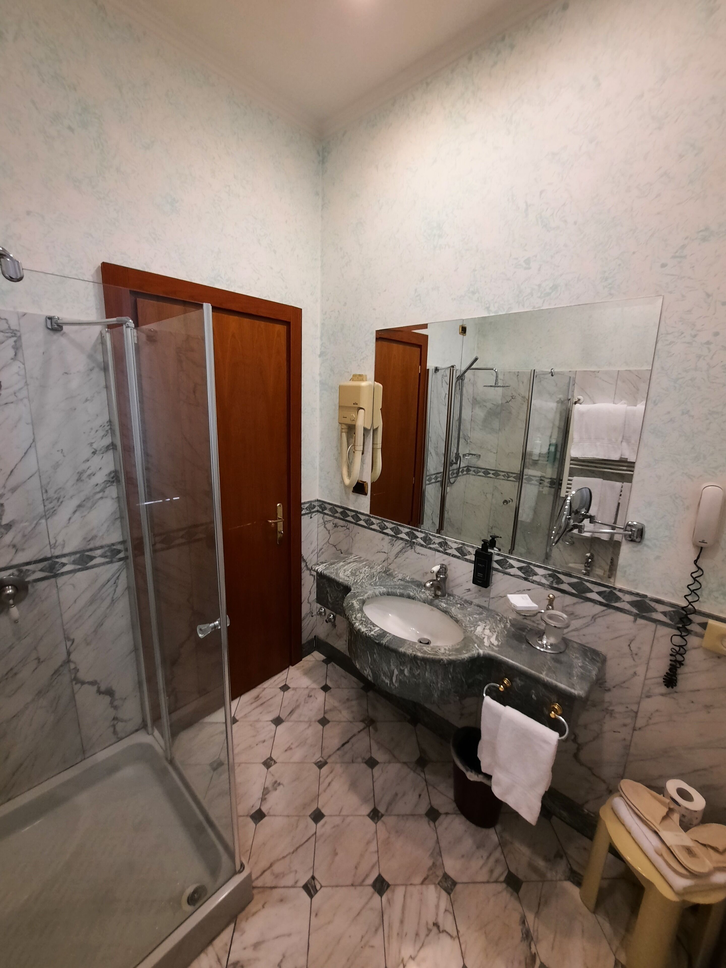 deep-soaking bathtub, rainfall showerhead, hair dryer, bidet