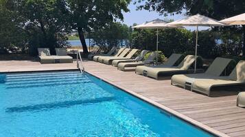 Seasonal outdoor pool, open 8:00 AM to 10:00 PM, pool umbrellas