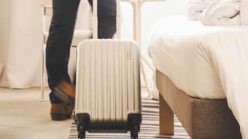 Cozy retreat with a comfortable bed, radiator, and ample space for luggage.