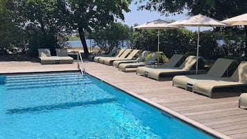 Seasonal outdoor pool, open 8:00 AM to 10:00 PM, pool umbrellas