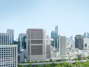 A cityscape with a prominent building labeled "CROWNE PLAZA". - Crowne Plaza Bangkok Lumpini Park by IHG (Bangkok)
