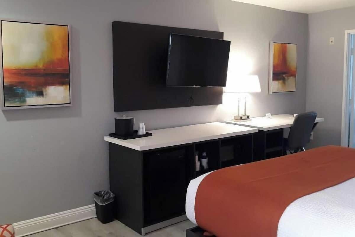 Desk, laptop workspace, blackout curtains, iron/ironing board