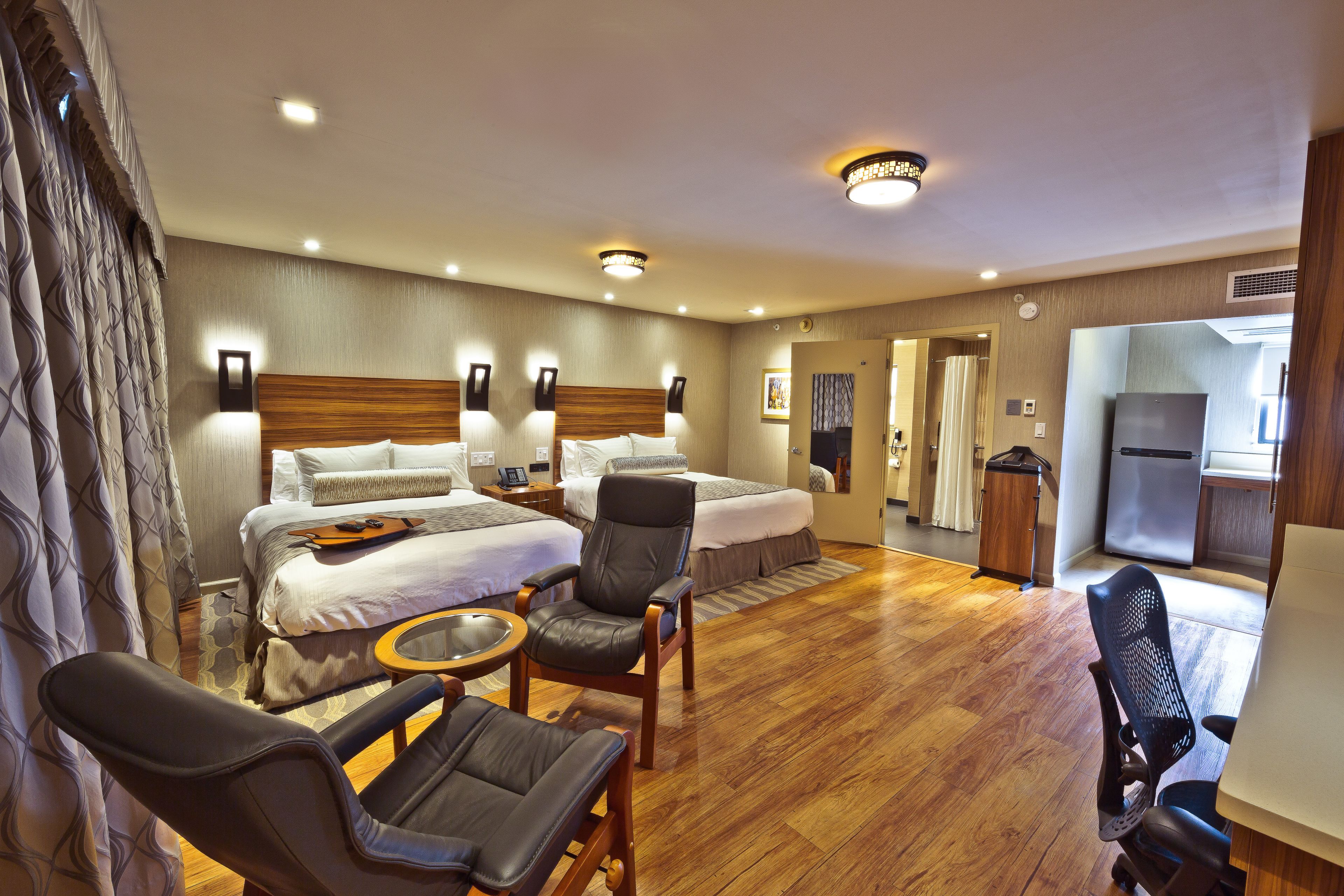 deluxe room, 2 queen beds (two queen bed non-smoking room) | premium bedding, down duvets, pillow-top beds, in-room safe