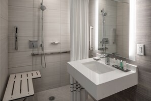 Combined shower/tub, designer toiletries, hair dryer, towels