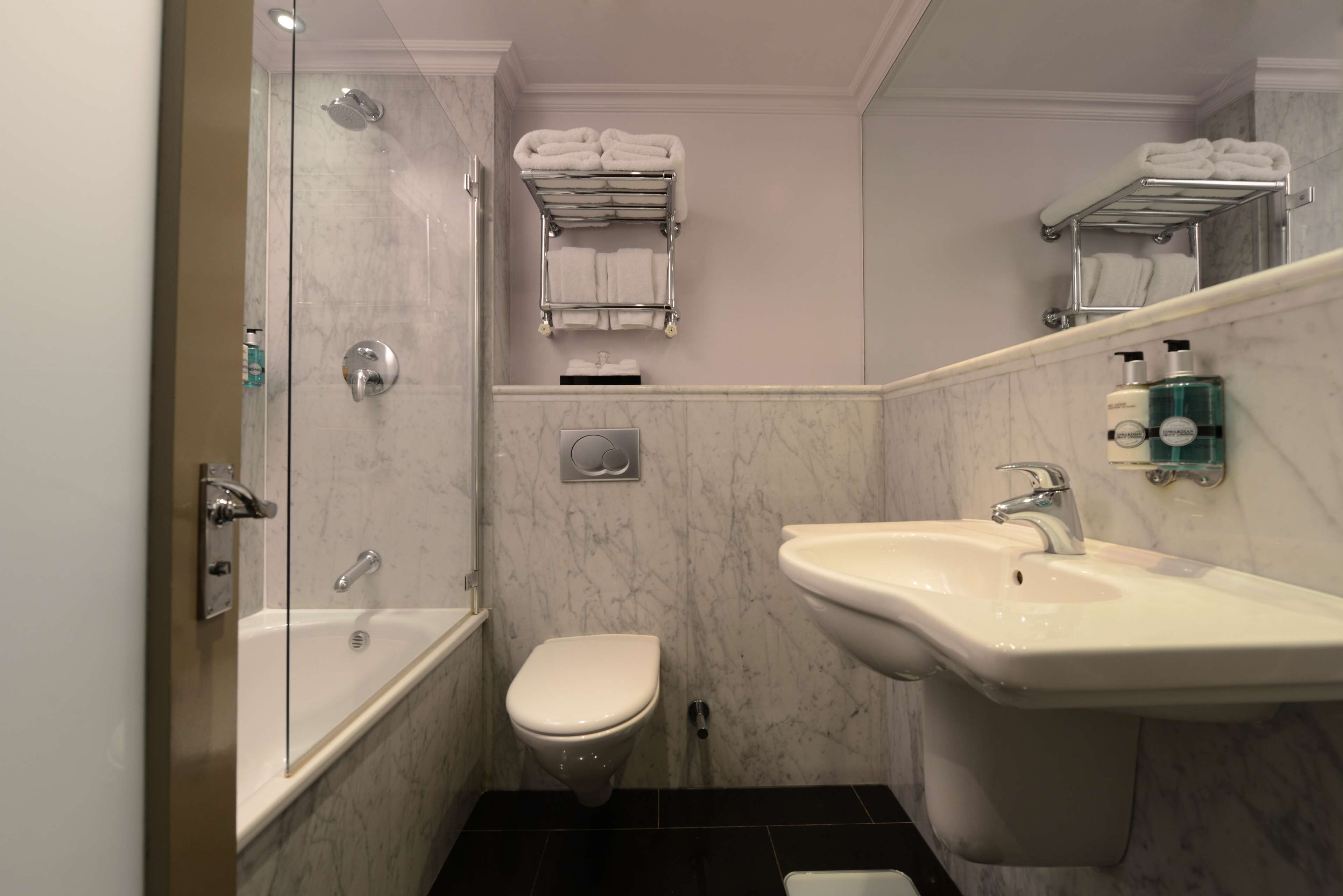 designer toiletries, hair dryer, towels, soap