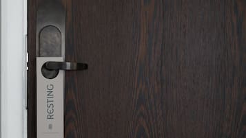 A door with a 'RESTING' sign and a keyhole.
